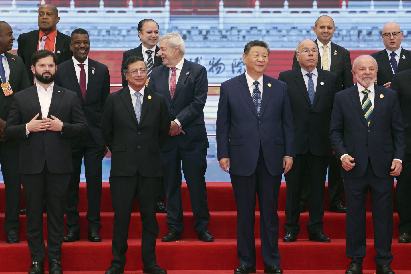 Chinese President Xi Jinping (front 2nd R), Brazil President Luiz Inacio Lula da Silva (front R), Chile President President Gabriel Boric (front L) and Colombia President Gustavo Petro (front 2nd L) attend a group photo session before the opening ceremony of the Fourth Ministerial Meeting of the Forum of China and Community of Latin American and Caribbean States (CELAC) in Beijing on May 13, 2025. 
